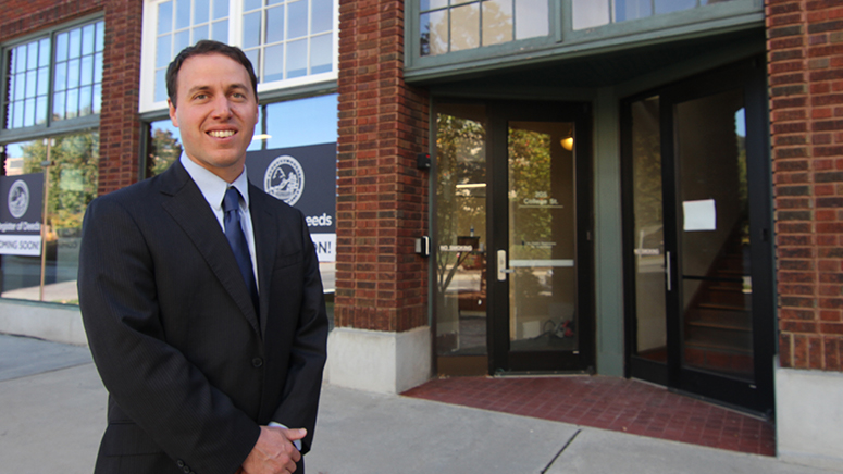 Register of Deeds Drew Reisinger standing outside their new location.