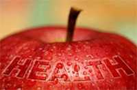 Photo of a red apple with the word HEALTH on it.