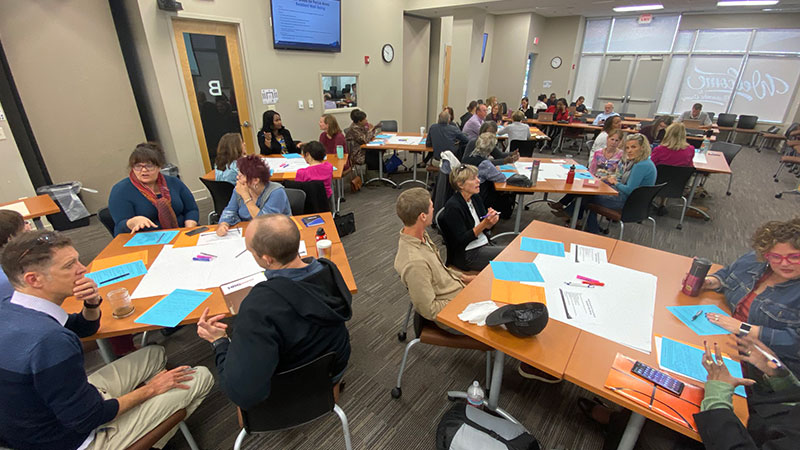 People gathering for strategic priorities training session