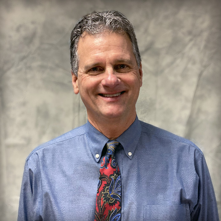 Professional portrait of Buncombe County Tax Appraiser Erik Simes