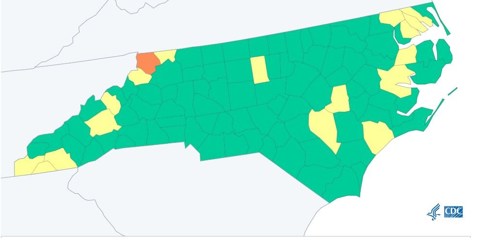 a map of North Carolina depicting CDC community levels for covid 19. buncombe is medium