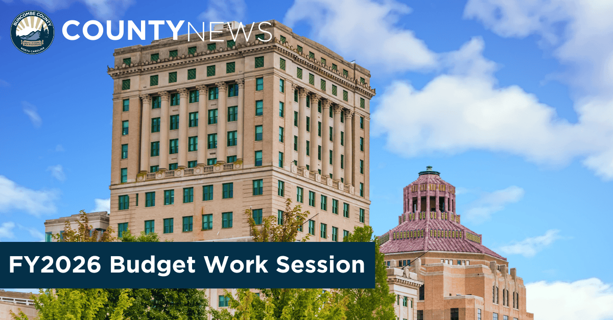Photo of the Buncombe County administration building with City of Asheville building in the back and superimposed text stating county news and FY2026 budget work session