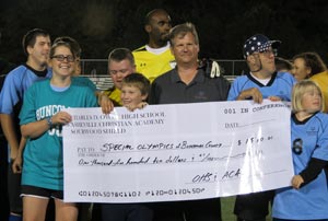 Photo of Buncombe County Special Olympics receiving check.