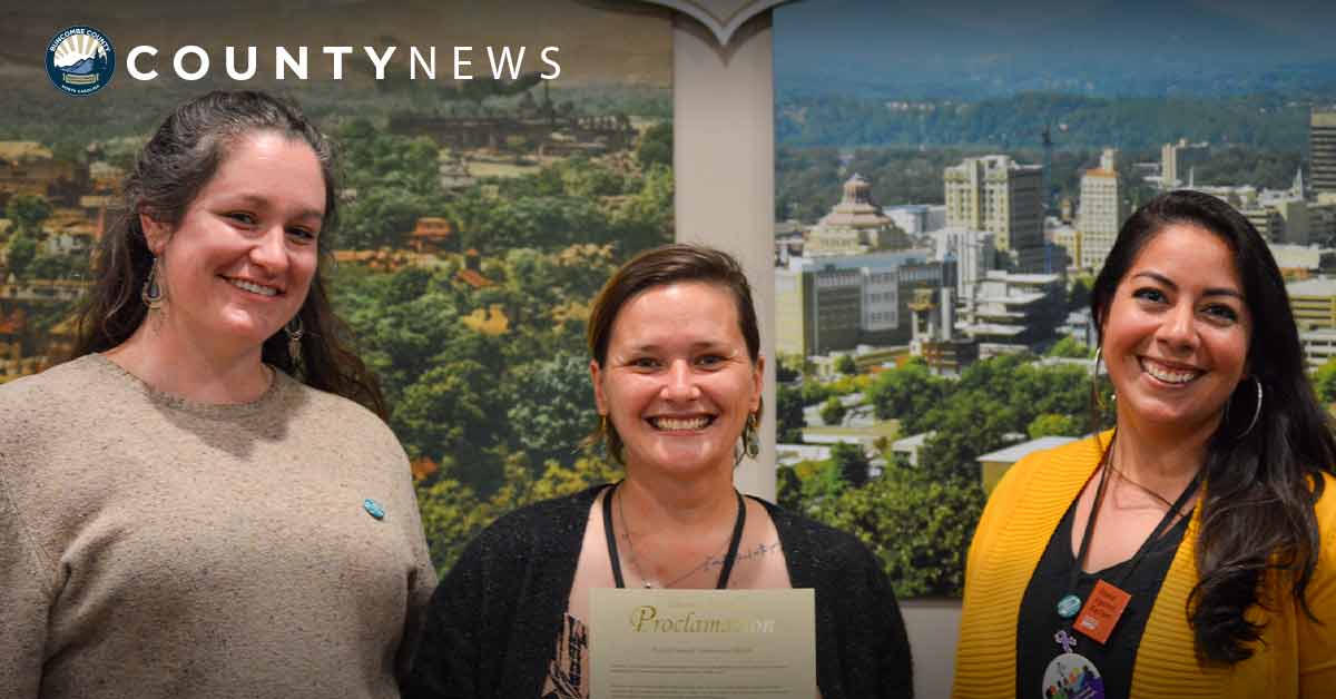 a group of women receives a sexual assault awareness proclamation