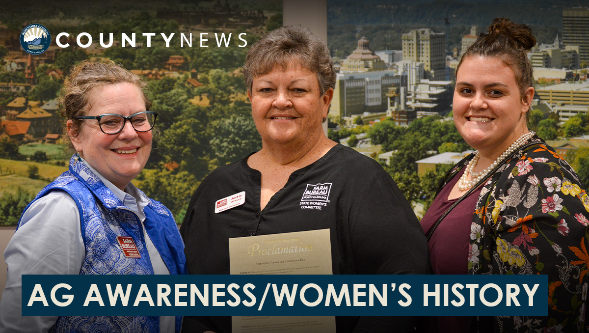 Jackie Gillespie and representatives of Buncombe County Farm Bureau accept an ag awareness proclamation.