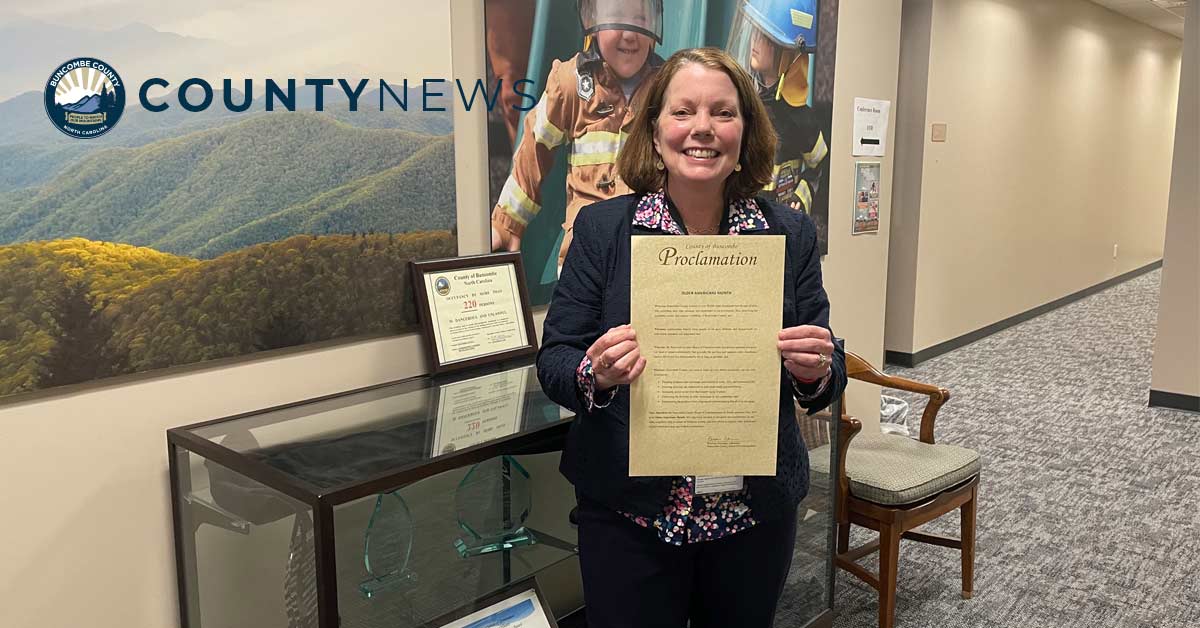 Billie Breeden holds a proclamation