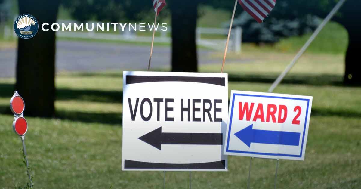 vote here signs in a field