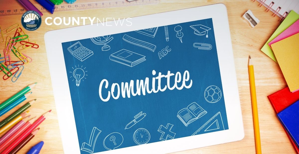 an ipad with the word committee on a colorful background