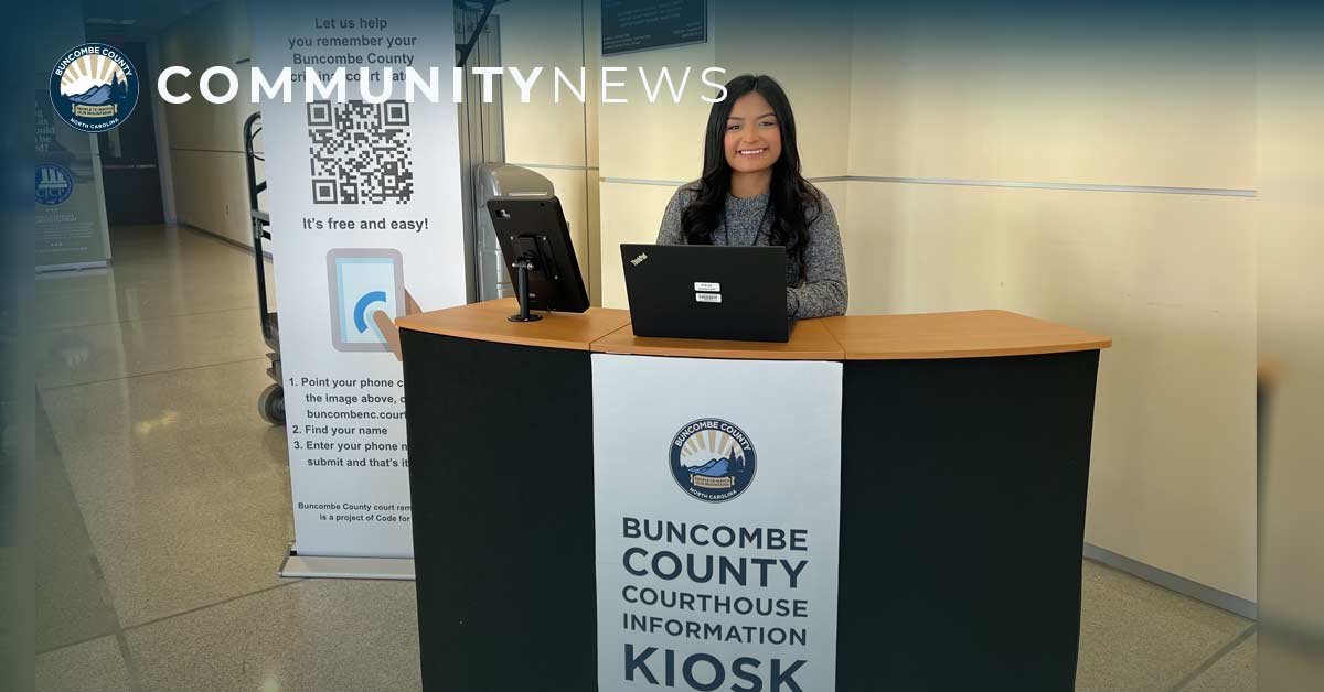 Betsy Chavez sits at an information kiosk in the courthouse