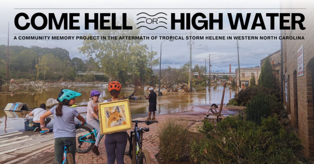 people look at flooded areas in the river arts district