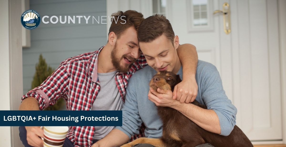 two men sit on their front porch with their dog