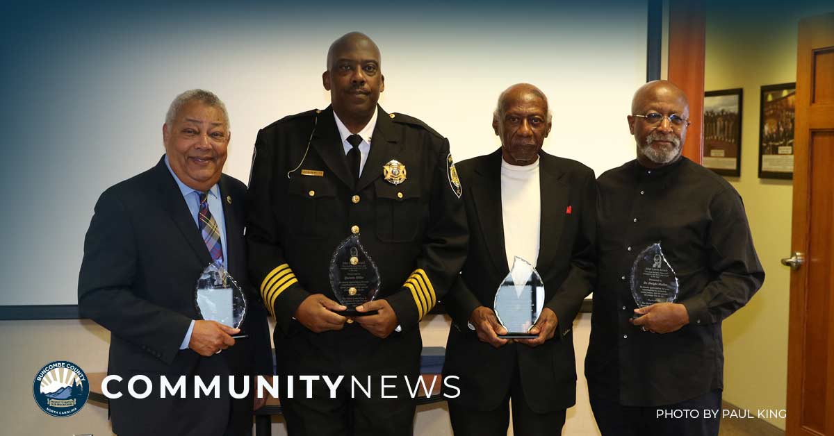 a photo of a group of men receiving an award