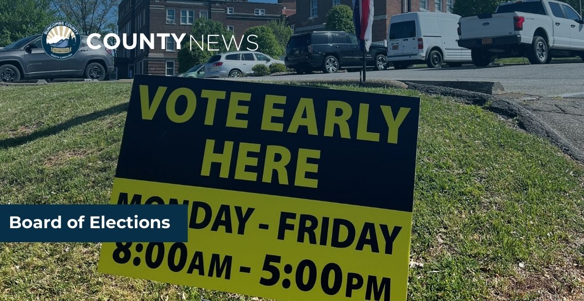 a photo of a vote here sign