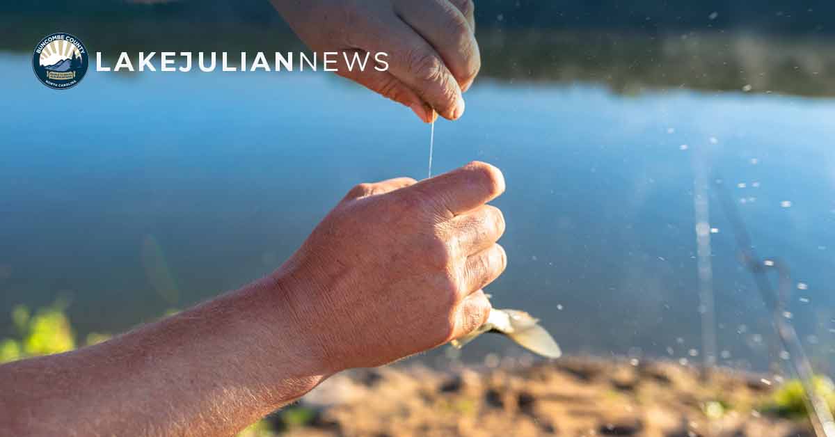 a man's hand holds a fishing line